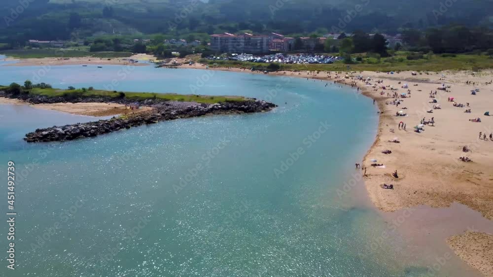 Aerial flight with drone above the beach and estuary of Orión, in Cantabria, Spain Aerial flight with drone above the beach and estuary of Orión, in Cantabria, Spain