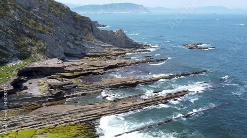 Aerial flight with drone over the Basque coast. Rocky cove between ravines