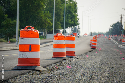 Road work construction and repair on street with safety cones