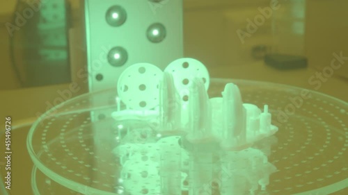 High quality 3D printing, cured with UV light, SLA, SLS, FDM printing techniques. Technology of the future, slow motion photo