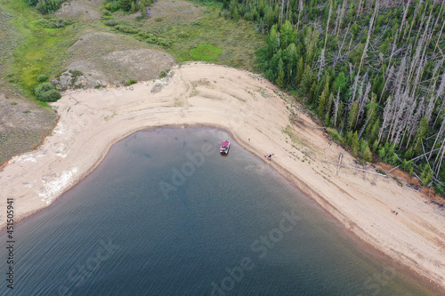 Aerial view of family and friends enjoying afternoon boating on Lake Granby in Arapaho National Recreation Area, Colorado on sunny summer day. photo