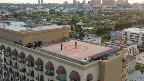 Bride and groom being photographed on helipad in Beverly Hills