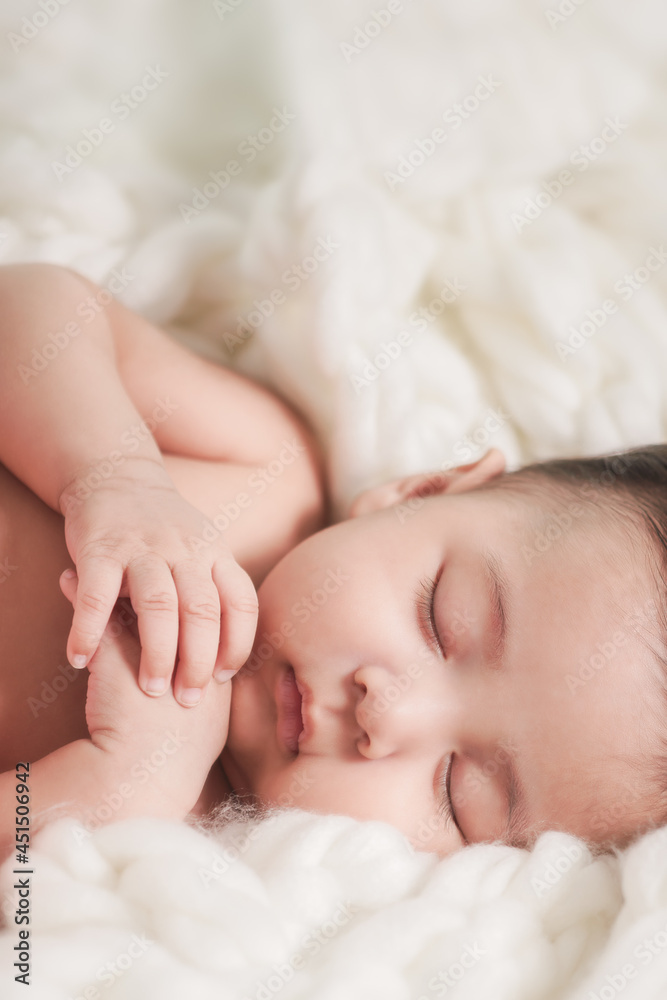 lovely baby boy sleeping on bed and holding hands lovely baby boy sleeping on bed and holding hands