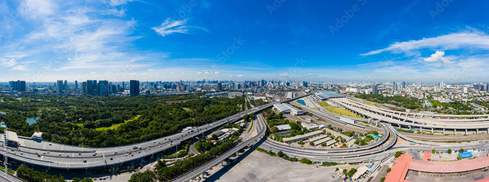 Bangkok skyline with new Bang Sue Grand Station in Bangkok, Thailand. Aerial view of Passenger and freight trains. Expressway top view