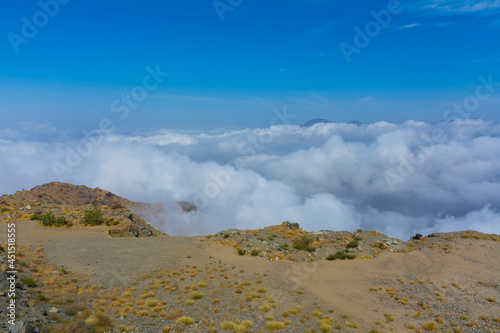 Mountain ridge in the clouds photo