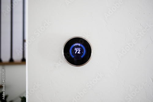 Digital modern thermostat at home