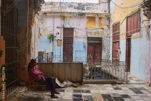 Photography Tenament life; crumbling, decaying colonial buildings in Havana Vieja, Havana, C