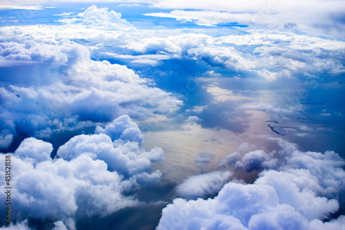 View of the clouds from above, looking down at the ocean. photo