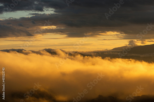 Aerial view Beautiful of morning scenery Golden light sunrise And the mist flows on high mountains, Wonder fog.