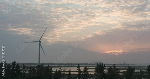 At sunset, China's rural coastal energy wind turbine time-lapse photography