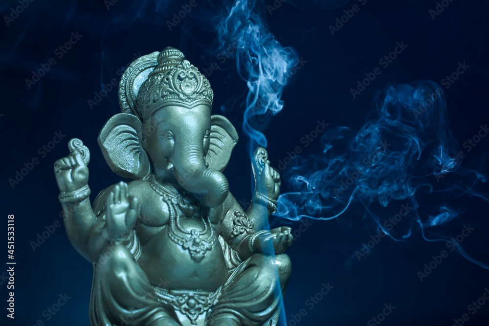lord ganesha sclupture over dark background. celebrate lord ganesha festival. lord ganesha sclupture over dark background. celebrate lord ganesha festival.