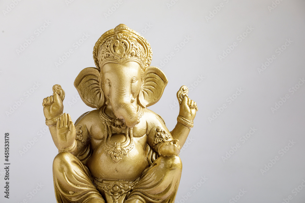 Golden lord ganesha sclupture over white background. celebrate lord ganesha festival.