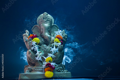 lord ganesha sclupture over dark background. celebrate lord ganesha festival.