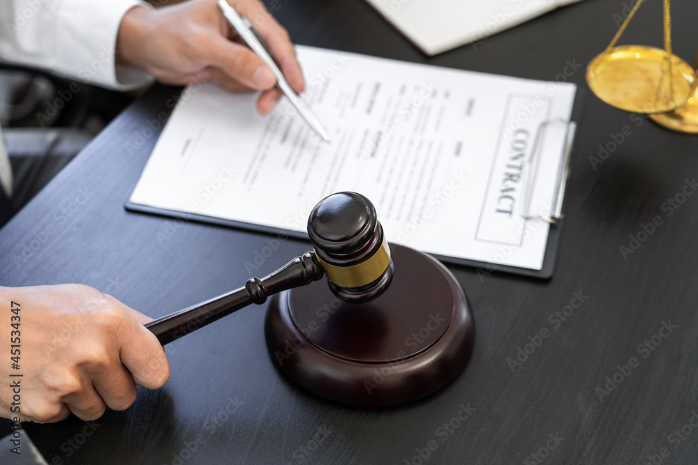 a lawyer checking the correctness in contract used in real estate transaction a lawyer checking the correctness in contract used in real estate transaction
