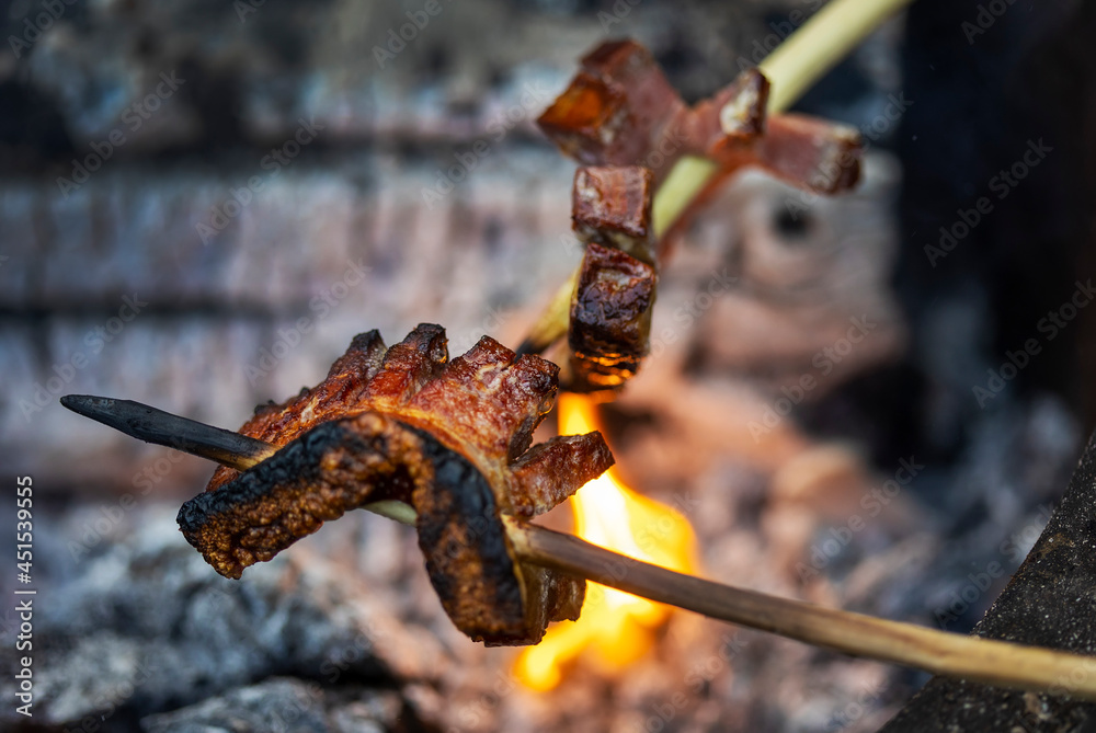 Fototapeta premium Bacon on skewer roasted at fire