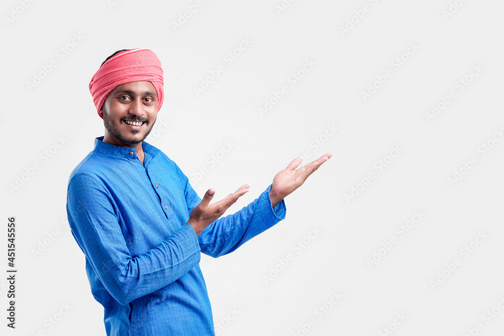 Young indian farmer giving expression on white background.