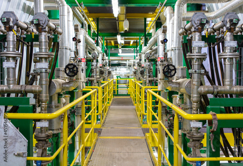 Set of valves and pipes. Factory interior.