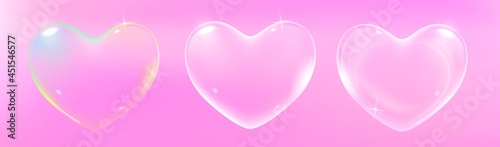 Set of realistic transparent pink, rainbow and white vector soap bubbles shaped as heart. Romantic glossy soapy heart. Valentine day symbol. Pink background.