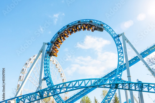 Amusement trolley makes circle loop turns upside down, roller coaster.