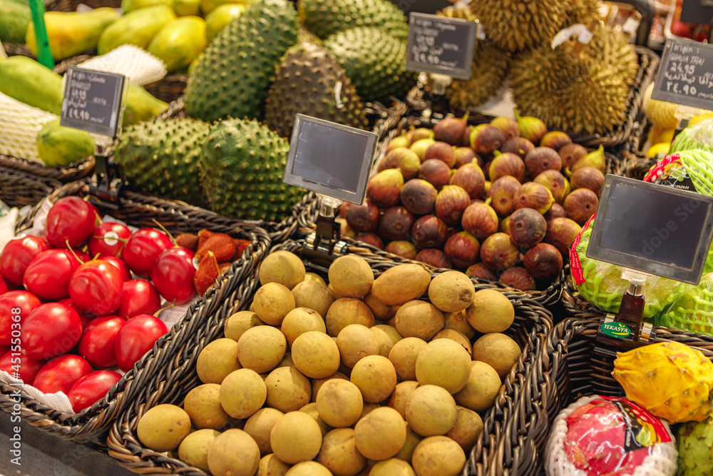 Assortment of fresh fruits on counter in supermarket