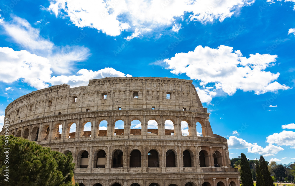 Fototapeta premium Colosseum with clear of blue sky background in Rome, Italy which Colosseum is a icon of the city, still standing today as a testament to ancient engineering.