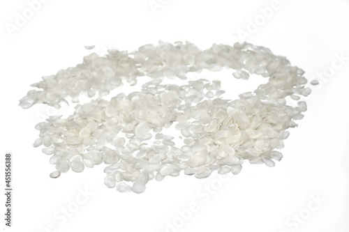 flattened rice flakes isolated on white.
