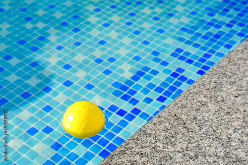 Surface of blue swimming pool with ball  background of water in swimming pool. Water background blue.