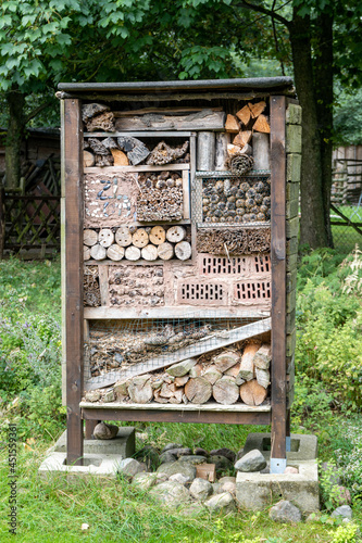 bee or insect hotel, board with holes and notches for insects