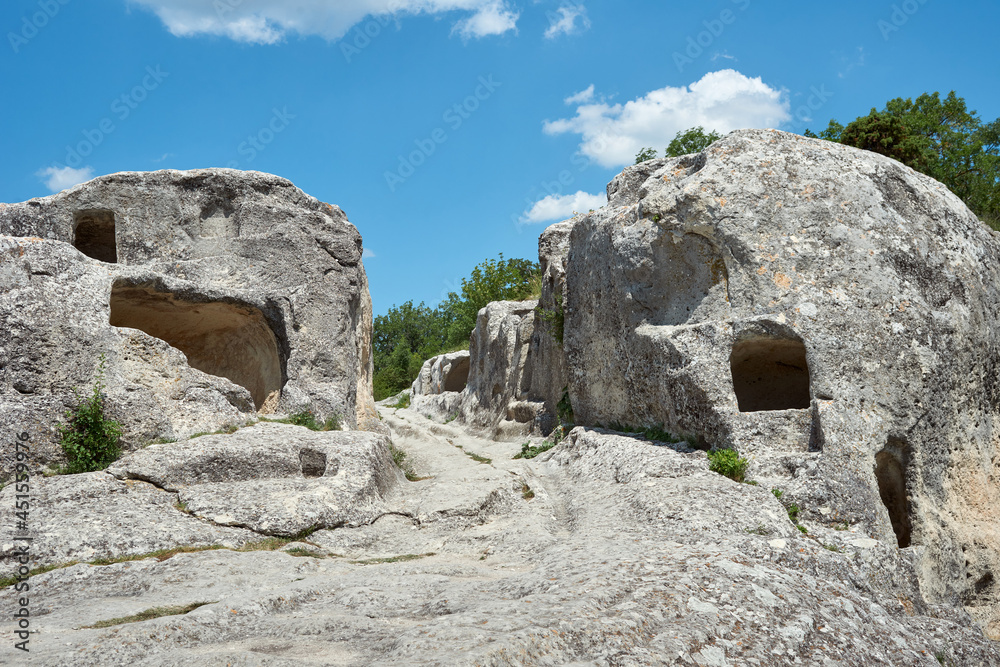 Ancient road in the cave city. Medieval fortress-city. Cave mountain town in Crimea.