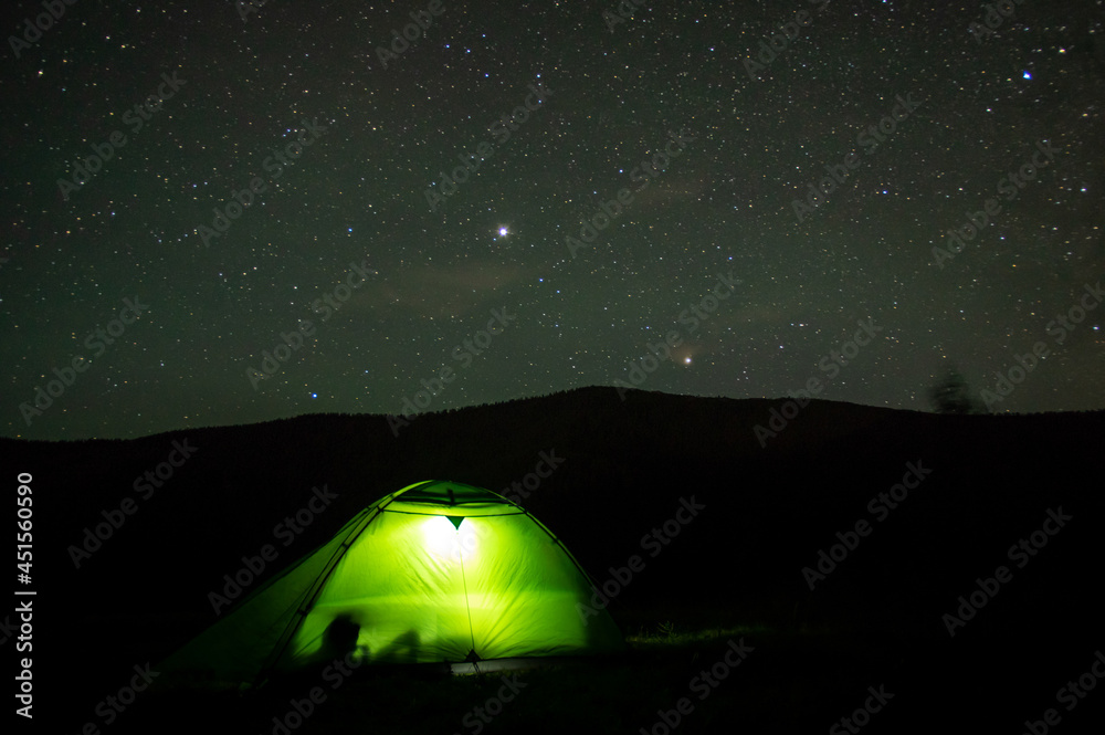 Beautiful night landscape, vacation with a tent in the mountains