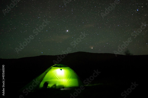 Beautiful night landscape  vacation with a tent in the mountains