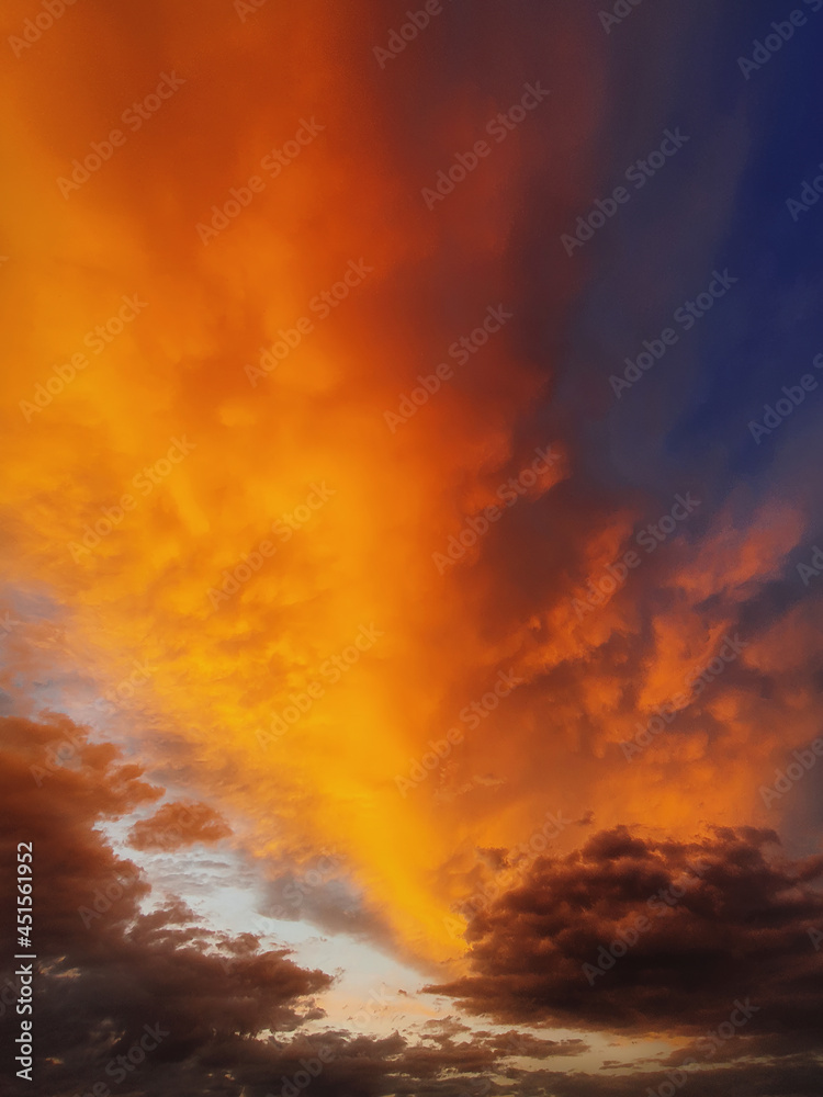 Colorful autumn sunset sky. Vertical background, abstract clouds shapes and colors. October seasonal celestial beauty. Panoramic dusk cloudscape scene. Misty overcast cumulus, abstract nebula textures Colorful autumn sunset sky. Vertical background, abstract clouds shapes and colors. October seasonal celestial beauty. Panoramic dusk cloudscape scene. Misty overcast cumulus, abstract nebula textures