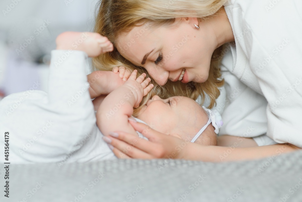 Portrait of young mother with cute baby at home Portrait of young mother with cute baby at home