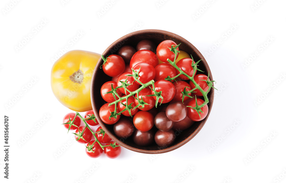 Ripe juicy cherry tomatoes in a bowl isolated on white background Ripe juicy cherry tomatoes in a bowl isolated on white background