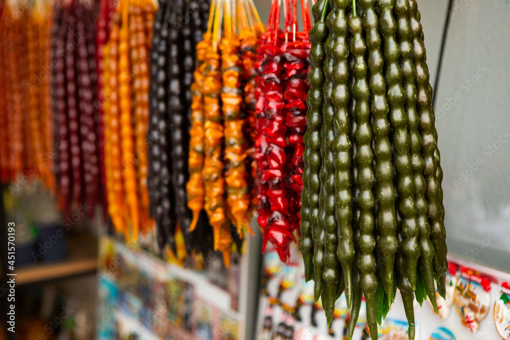 Fototapeta premium Churchkhela is a traditional Georgian cuisine candle-shaped candy. Beautiful country Georgia in summer.