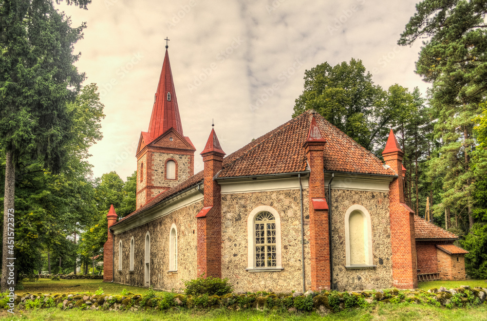 Lutheran church, made of stones ar red bricks, Rinda, Latvia.