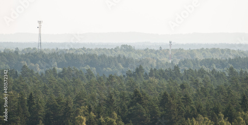 Aerial view of forest and towers in sunny summer day, Latvia. photo