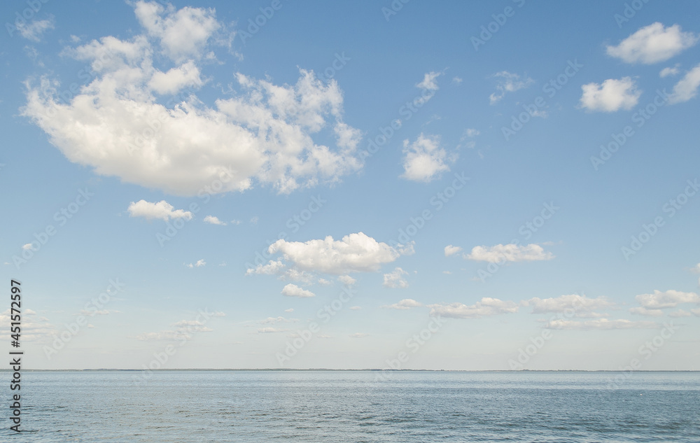 Big lake with clouds in sunny summer day, Lithuania.