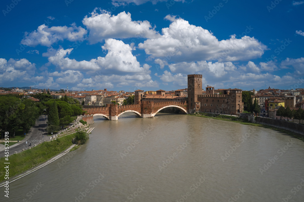 Verona, Italy aerial view of the historic city. Aerial panorama of the famous Ponte di Castelvecchio in Verona. Famous Italian Bridge aerial view. Unesco Monument Scaliger Bridge in Italy top view.