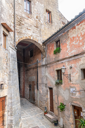 picturesque view of Sorano with old staircase, alley, underpass and plants in the Tuscan medieval village © Karl Allen Lugmayer