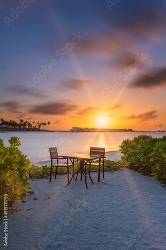 Outdoor restaurant with views of ocean and beautiful sky at sunrise. Crossroads Maldives  saii lagoon. Long exposure picture. July 2021