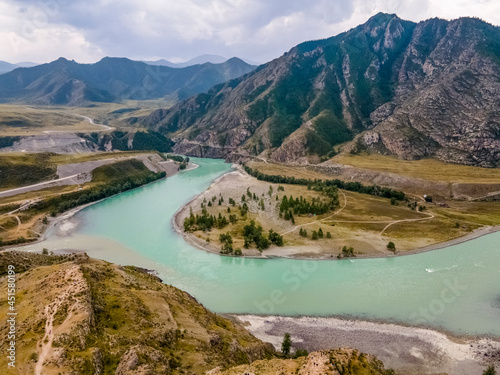 The Katun river with turquoise water. Beautiful landscape. Mountains and hills. Altai Mountains, Russia. Aerial view