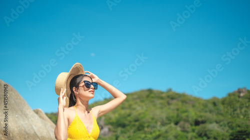women portrait on the tropical beach wear yellow , rock beach, Crystal bay, Lamai , koh samui ,Suratthani ,thailand © kongkiat chairat