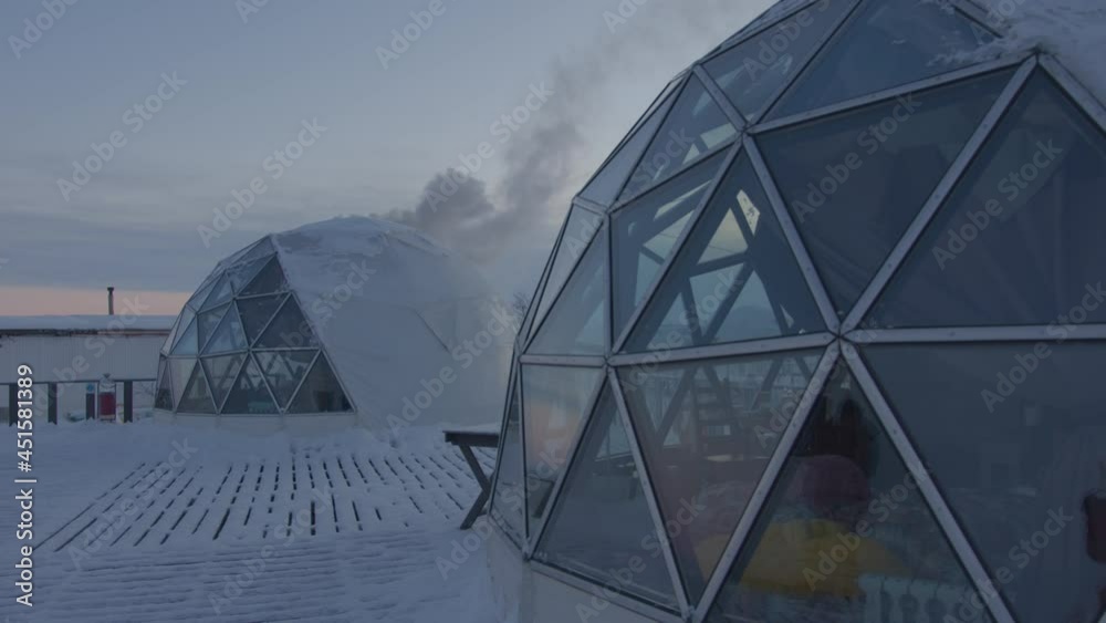 original glamping from an igloo with glass panoramic windows on a winter day