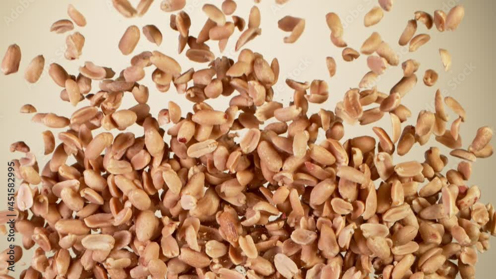 Super Slow Motion Shot of Flying Roasted Peanuts. Filmed on High Speed Cinematic camera at 1000 fps.