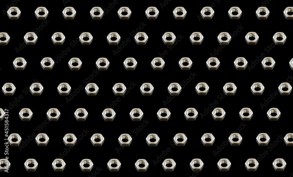 Background for the banner and design. The pattern. Metal nut with thread on a black background