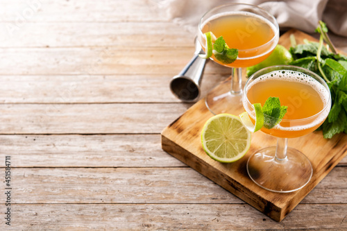 Old Cuban cocktail on wooden table. Copy space.Alcoholic drink based on rum and champagne