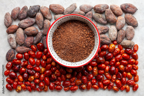 Spice blend made of raw cocoa and dried chili pepper. Spicy cacao condiment top view. photo