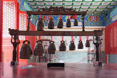 Foshan, Guangdong, China. Xi Qiao Mountain Guoyi Movie and TV City. Confucius garden. Tabletop bronze bells, object of worship. 