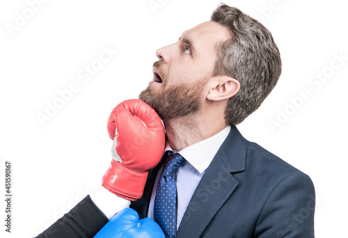 An uppercut crashes into his jaw. Businessman got punch in face. Knockout punch
